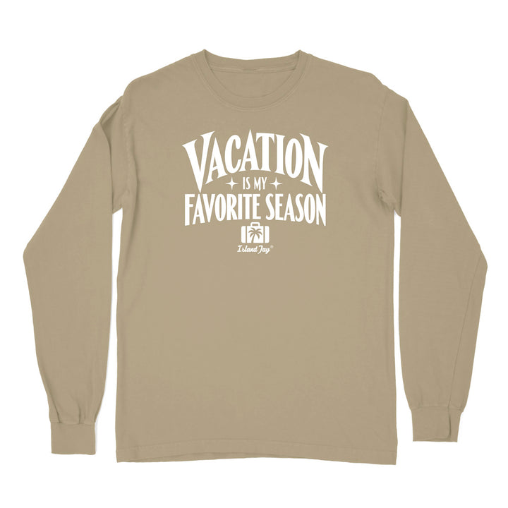 A tan long-sleeve t-shirt with a white graphic print on the front that reads 'VACATION IS MY FAVORITE SEASON' 