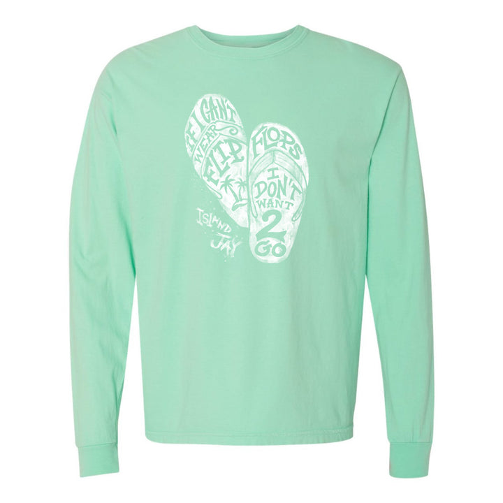 Mint green long-sleeve shirt with white graphic design on a white background