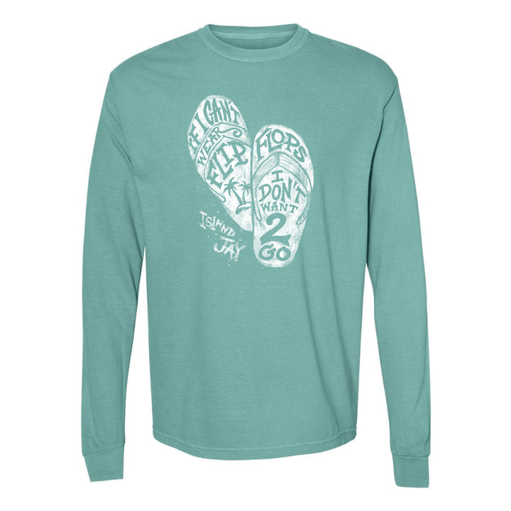 Teal long-sleeve shirt with white graphic design on a white background