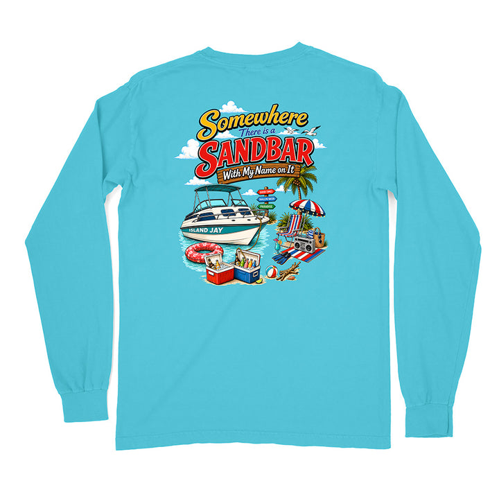 A light blue long-sleeve t-shirt with a colorful graphic print on the back featuring a speedboat, beach umbrella, towels, and the text 'Somewhere Sandbar With My Name on It'.