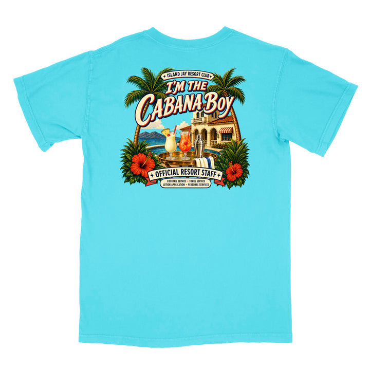 A light blue short-sleeve t-shirt shown flat against a white background, featuring a large colorful graphic print on the back with palm trees, hibiscus flowers, a beach bar scene, and the text 'I'm The Cabana Boy' and 'Official Resort Staff'.