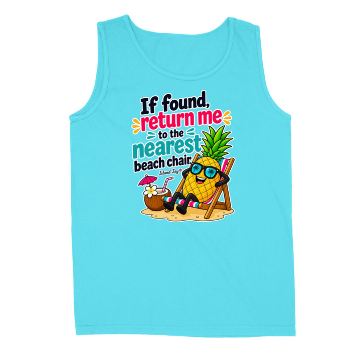 A light blue sleeveless tank top with a colorful graphic on the front showing a pineapple character wearing sunglasses and reclining on a beach chair next to a coconut drink, with the text 'If found, return me to the nearest beach chair. Island Shop'.