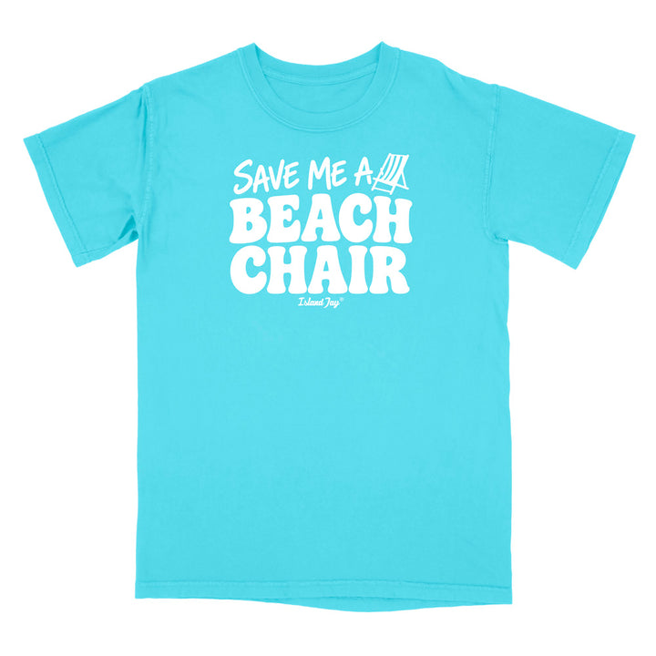 A bright turquoise blue short-sleeve t-shirt with a bold white graphic on the chest reading 'SAVE ME A BEACH CHAIR' 