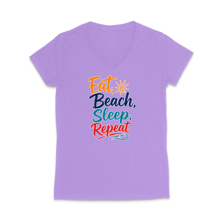 A lavender purple v-neck t-shirt with a colorful graphic text print reading 'Eat, Beach, Sleep, Repeat' on the chest, displayed against a plain white background.