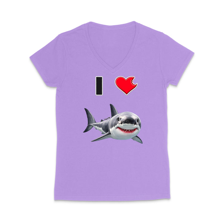 A women's short-sleeve V-neck t-shirt in light purple, featuring a graphic print of a smiling great white shark with the text 'I' and a red heart above it.