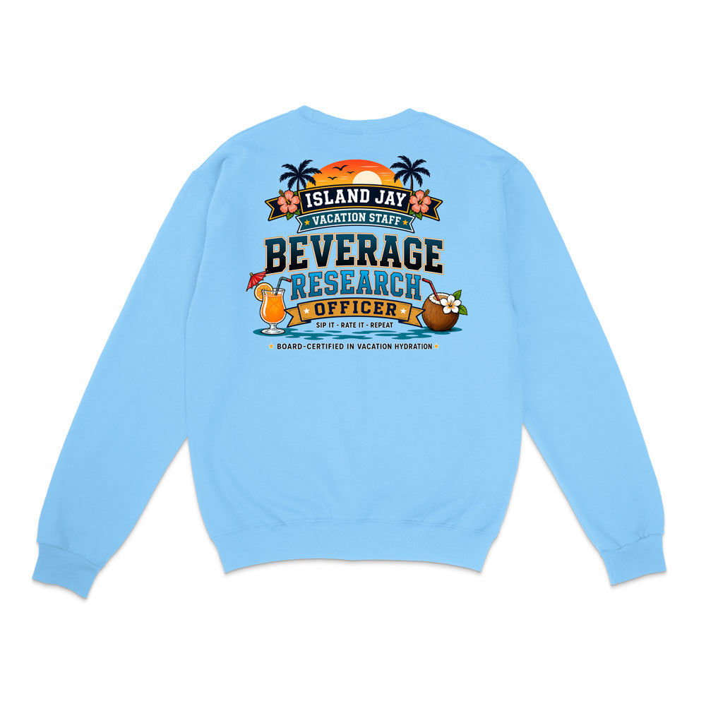 A light blue crewneck sweatshirt shown from the back, featuring a colorful graphic print with tropical island elements and the text 'ISLAND JAY BEVERAGE RESEARCH OFFICER'.
