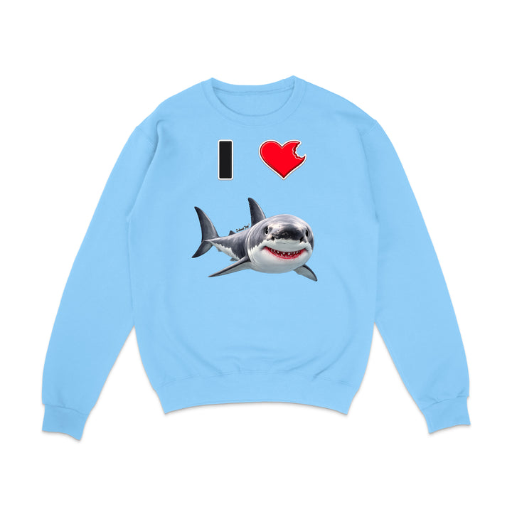 A light blue crewneck sweatshirt featuring a graphic print of a great white shark and the text 'I' followed by a red heart, displayed on a clean white background.