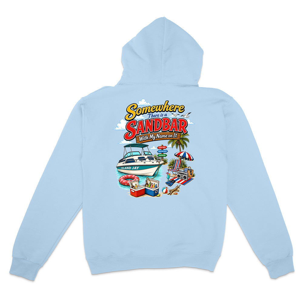 A light blue hooded sweatshirt shown from the back, featuring a colorful graphic print with the text 'Somewhere in Sandbar' and a beach-themed illustration including a boat, palm tree, beach umbrella, and cooler.