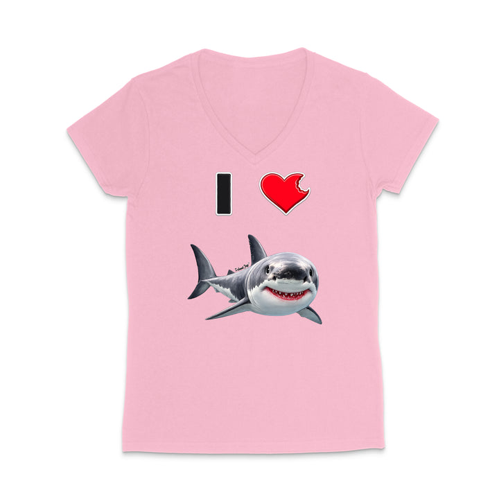 A light pink women's V-neck t-shirt featuring a graphic print of a cartoon shark and the text 'I' followed by a red heart, displayed on a clean white background.