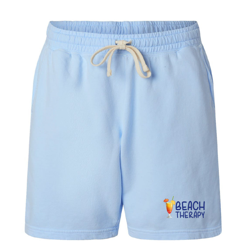 Light blue shorts with a 'Beach Therapy' logo on a white background