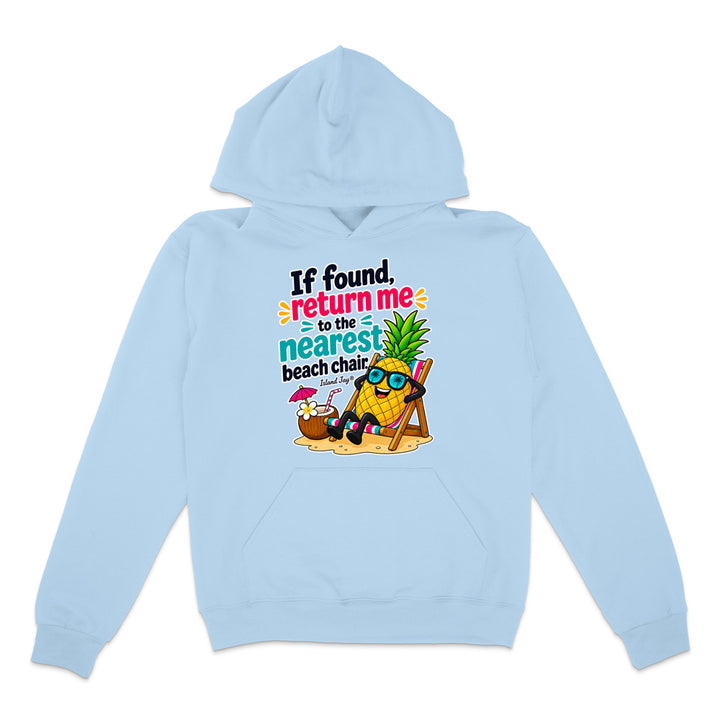 A light blue pullover hoodie with a colorful graphic on the chest. The graphic features a cartoon pineapple wearing sunglasses and relaxing in a beach chair next to a cocktail umbrella, with the text 'If found, return me to the nearest beach chair' in playful multicolor lettering.