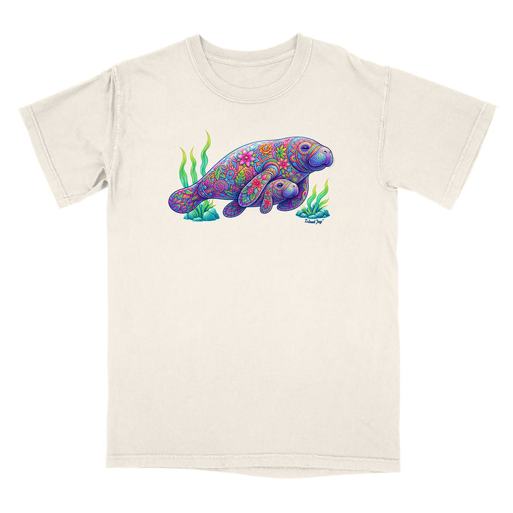 Beige t-shirt with a colorful manatee design on a white background