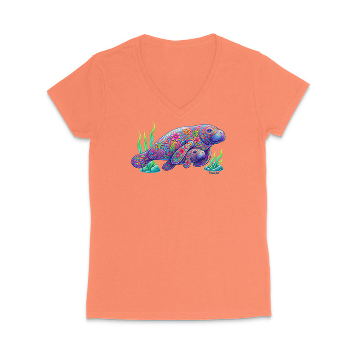 Peach-colored t-shirt with a colorful sea turtle design on a white background