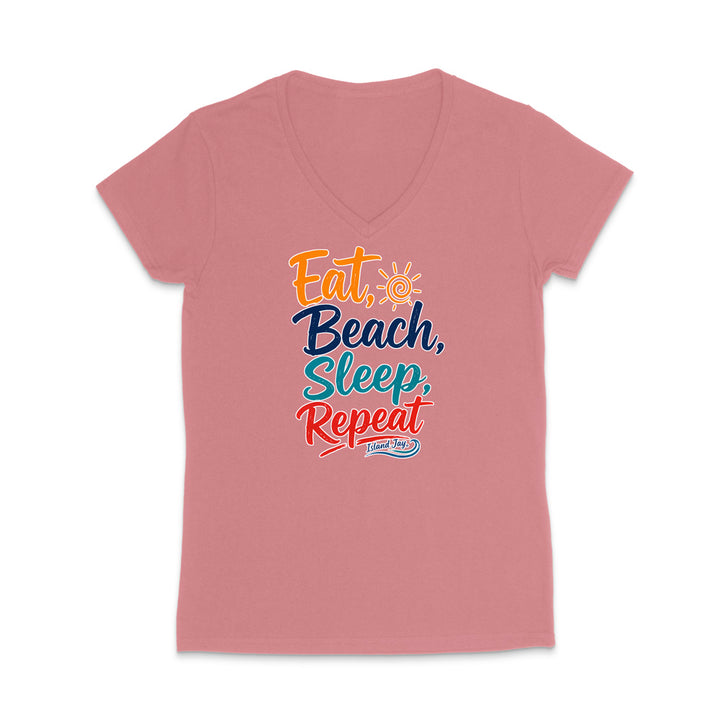 A dusty rose pink V-neck t-shirt with a colorful graphic text print reading 'Eat, Beach, Sleep, Repeat' and 'Jesus Saves' underneath, displayed on a clean white background.