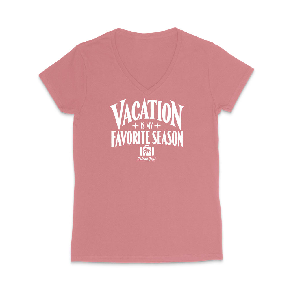 A dusty rose pink V-neck t-shirt with a white graphic print that reads 'VACATION IS MY FAVORITE SEASON' and a small 'Tulum Joy' logo underneath, displayed on a clean white background.