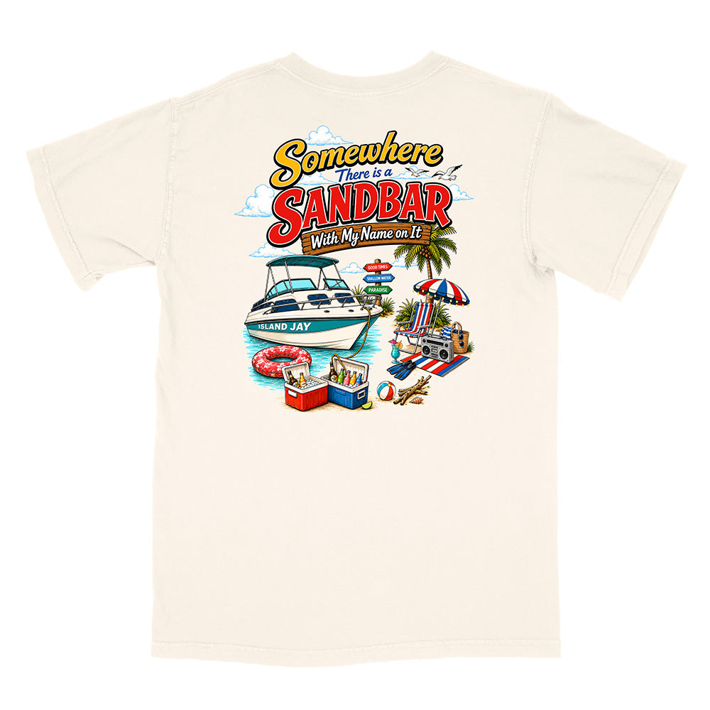 An off-white short-sleeve t-shirt with a colorful graphic print on the front. The graphic features the text 'Somewhere There is a SANDBAR Wish My Name was It' above an illustration of a boat, beach umbrella, cooler, and palm tree.