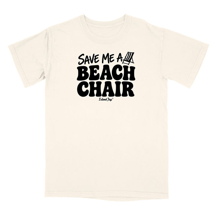 An off-white short-sleeve t-shirt with a black graphic print on the chest reading 'SAVE ME A BEACH CHAIR' 
