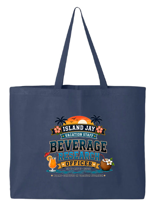 A navy blue canvas tote bag with long shoulder straps, featuring a colorful graphic print on the front that reads 'ISLAND JAY VACATION STAFF BEVERAGE RESEARCH OFFICER' with tropical illustrations including a sunset, palm trees, a cocktail, and a coconut drink.