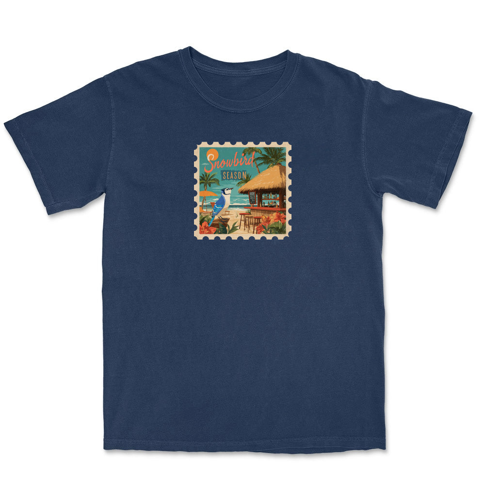 Navy blue t-shirt with a tropical island graphic on a white background