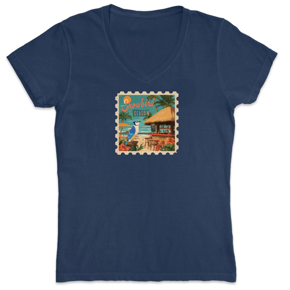 Navy blue t-shirt with a tropical stamp design featuring a hut and palm trees on a white background.
