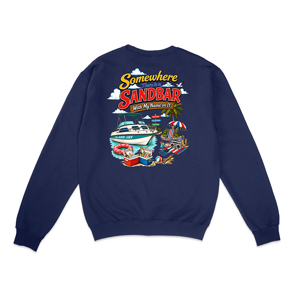 A navy blue crewneck sweatshirt shown from the back, featuring a colorful graphic print with the text 'Somewhere in the Sandbar With My Mums on It' and illustrations of a boat, beach umbrella, and poolside scene.