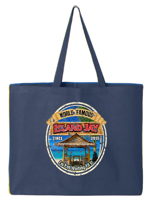 A navy blue canvas tote bag with a large circular graphic on the front that reads 'World Famous Island Jay' and features a beach scene with a gazebo and blue water.