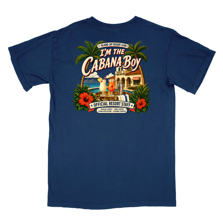 A navy blue short-sleeve t-shirt shown from the back, featuring a large, colorful graphic print with palm trees, hibiscus flowers, a resort building, and the text 'I'M THE CABANA BOY' and 'OFFICIAL RESORT STAFF'.