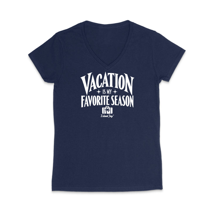 A navy blue women's V-neck t-shirt with a white graphic print on the front that reads 'VACATION IS MY FAVORITE SEASON' with a small palm tree and 'Island Trip' logo underneath, displayed on a clean white background.