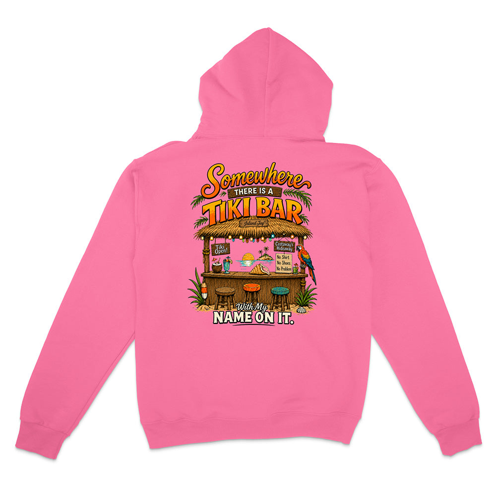 A pink zip-up hoodie shown from the back, featuring a colorful graphic of a tropical 'Tiki Bar' with the text 'Somewhere There Is A TIKI BAR' and 'YOUR NAME ON IT'.