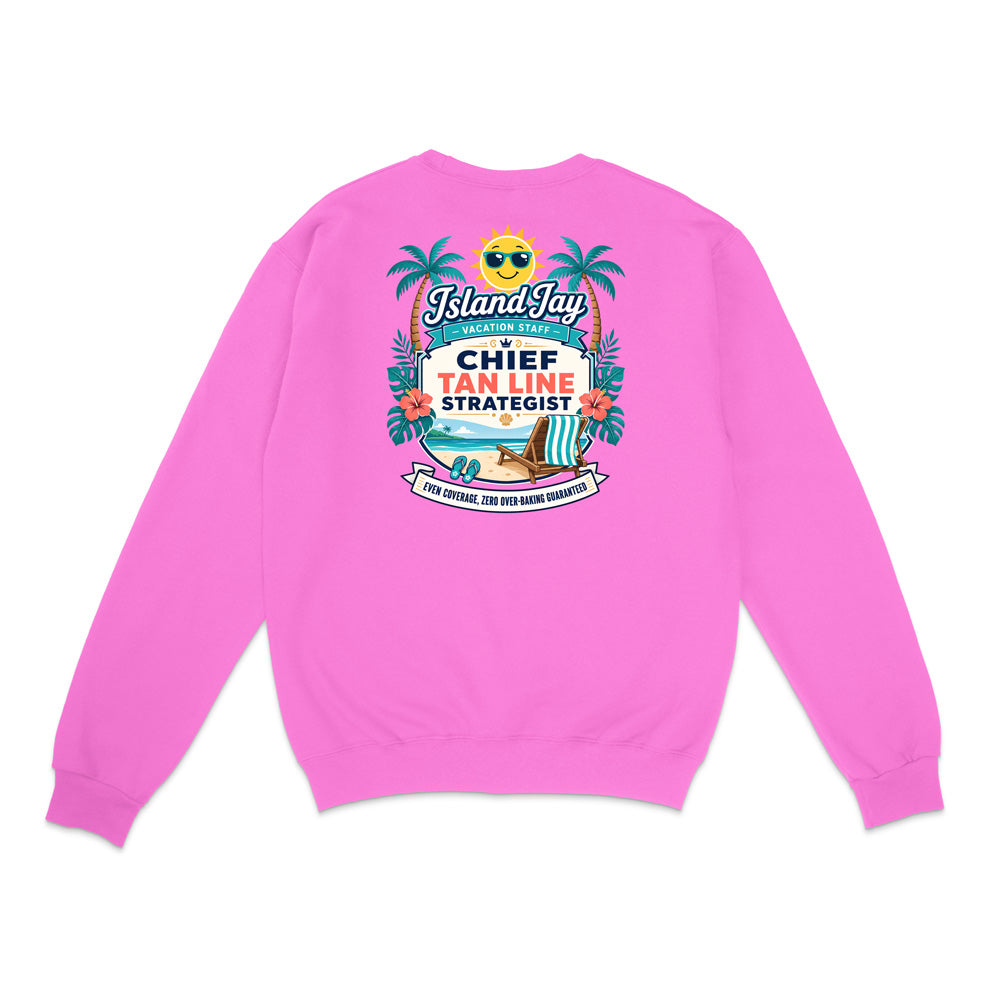 A bright pink crewneck sweatshirt shown from the back, featuring a colorful graphic print with palm trees, a beach chair, and text that reads 'Chief Tan Line Strategist' and 'IslandJazz'.