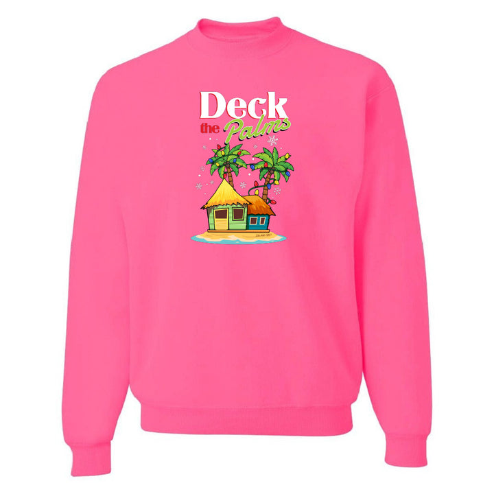 Neon Pink sweatshirt with a tropical hut and palm tree design and graphic text reading "Deck The Palms" on a white background