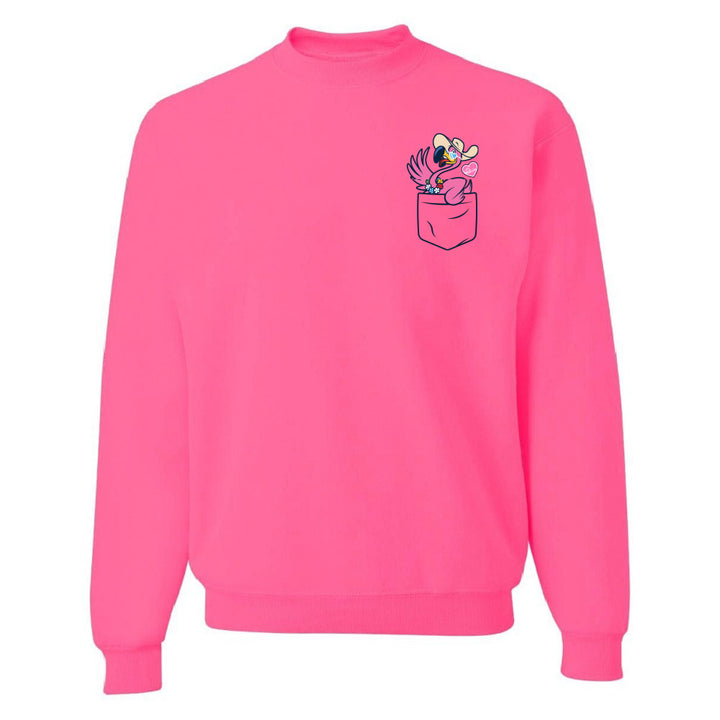 Pink sweatshirt with a small graphic on the chest pocket against a white background