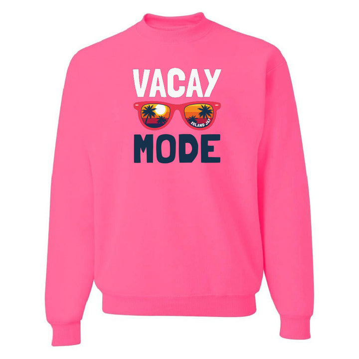 Pink sweatshirt with 'VACAY MODE' text and sunglasses graphic on a white background