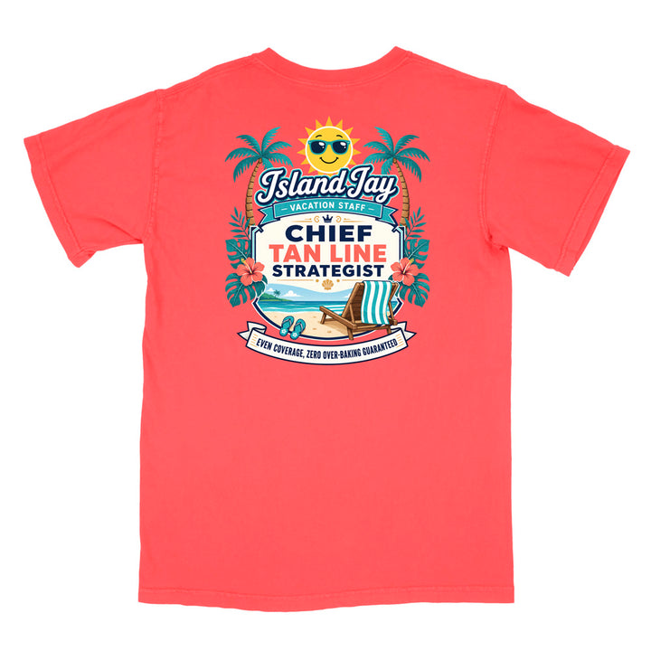 A coral short-sleeve t-shirt with a colorful graphic print on the front. The graphic features a smiling sun wearing sunglasses, palm trees, a beach scene, and text that reads 'Island Jay Vacation Staff by CHIEF TAN LINE STRATEGIST'.