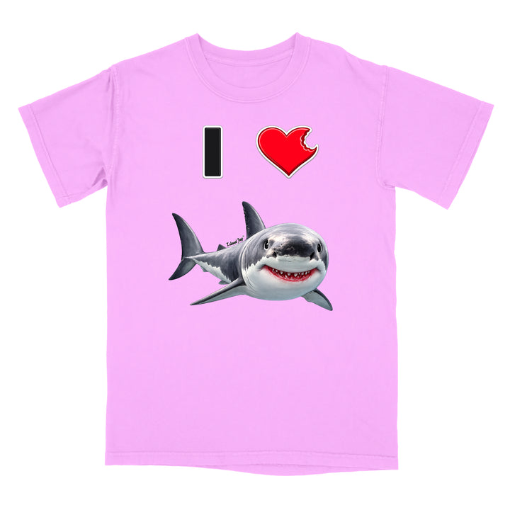 A light purple short-sleeve t-shirt with a graphic print of a great white shark and a red heart with a bite taken out of it, alongside a black vertical bar, on a plain white background.
