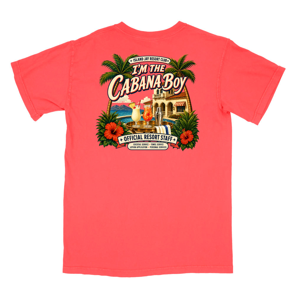 A coral pink short-sleeve t-shirt shown from the back, featuring a large colorful graphic print with the text 'I'm The Cabana Boy' and tropical resort-themed artwork.
