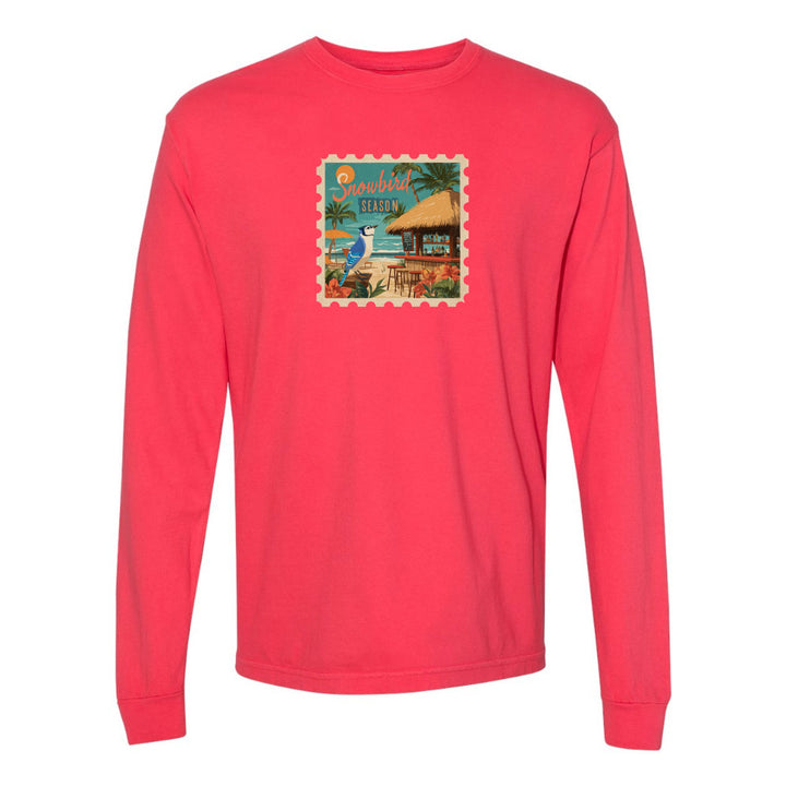 Red long-sleeve shirt with a beach-themed graphic on a white background