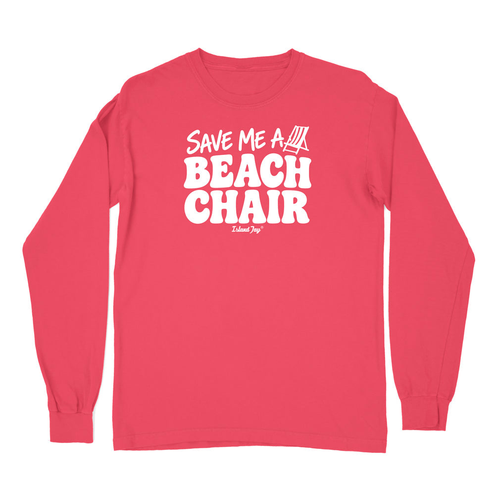 A long-sleeve crewneck t-shirt in a vibrant coral pink color, featuring a bold white graphic print on the chest that reads 'SAVE ME A BEACH CHAIR' 