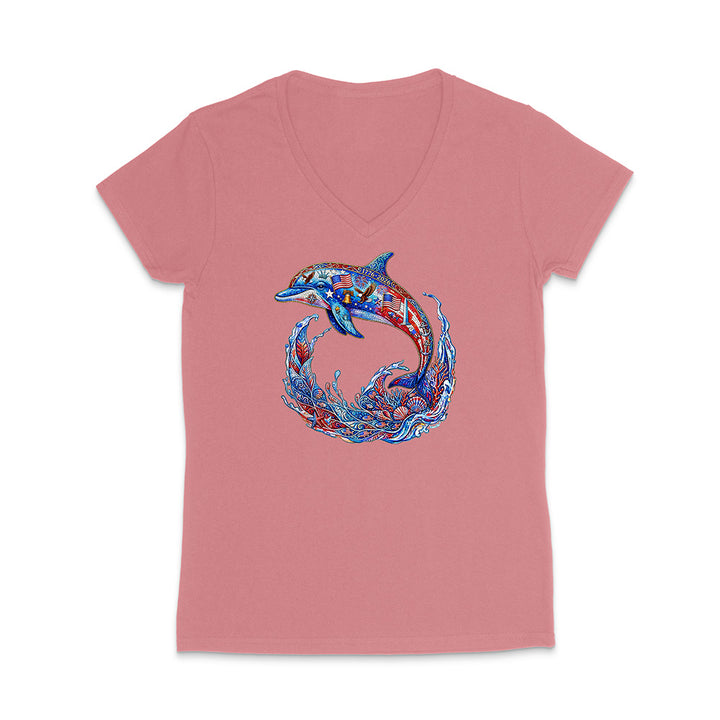 Pink t-shirt with a colorful dolphin design on a white background