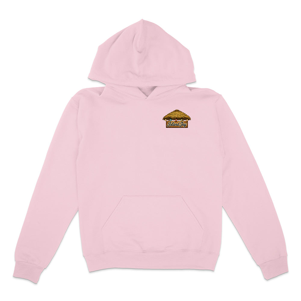 A light pink pullover hoodie with a small graphic print on the left chest depicting a thatched-roof hut with the text 'SUNSET VILLAGE'. The hoodie is shown flat against a plain white background.