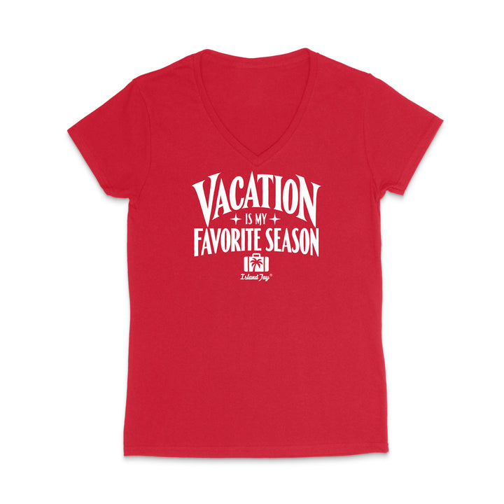 A red women's V-neck short-sleeve t-shirt with a white graphic text print reading 'VACATION IS MY FAVORITE SEASON' and a small 'Island Joy' logo underneath, shown on a plain white background.