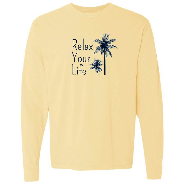 Yellow long-sleeve shirt with 'Relax Your Life' text and palm tree graphics on a white background