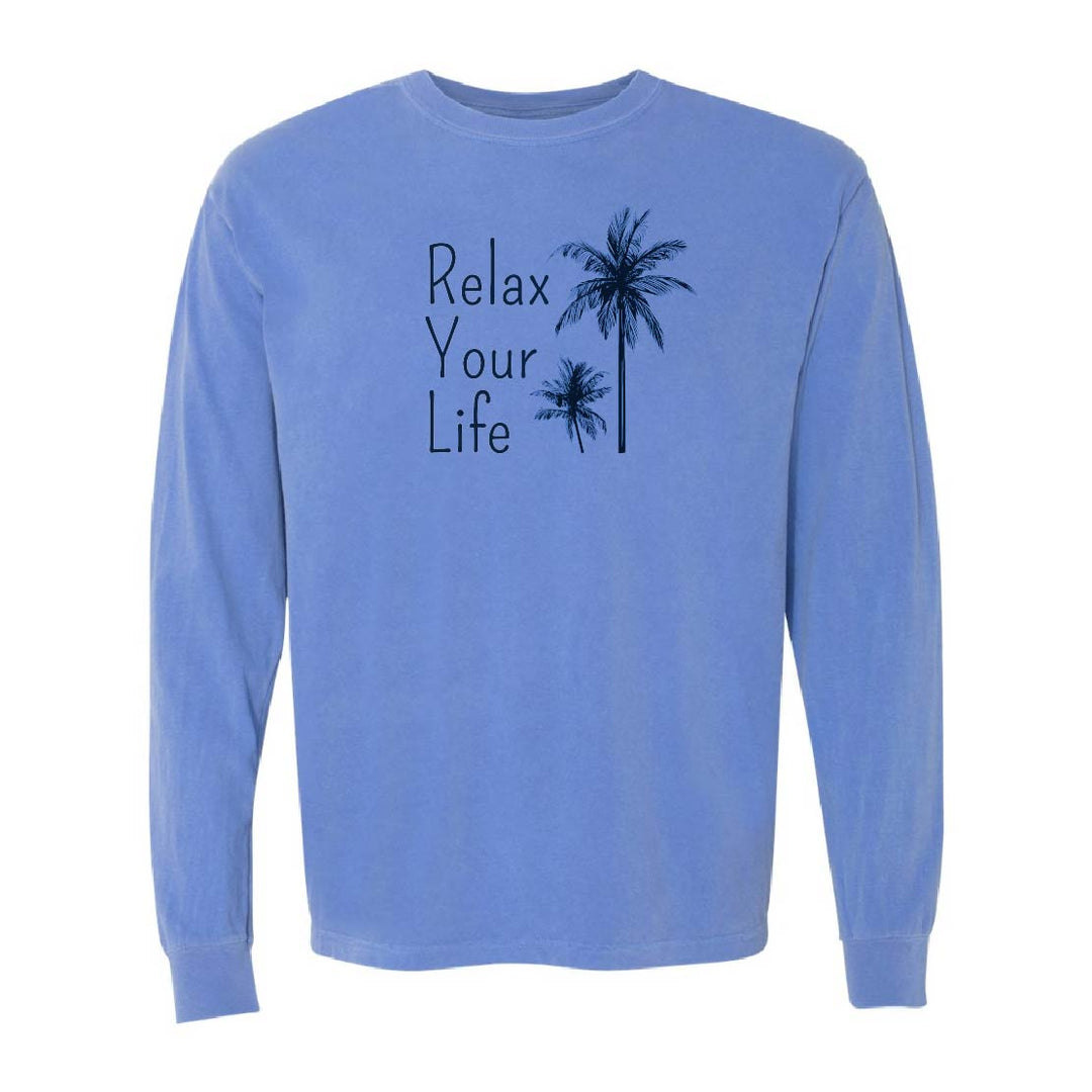 Blue long-sleeve shirt with 'Relax Your Life' text and palm tree design on a white background