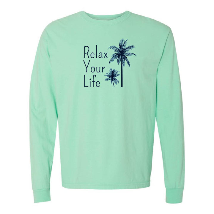 Mint green long-sleeve shirt with 'Relax Your Life' text and palm tree design on a white background