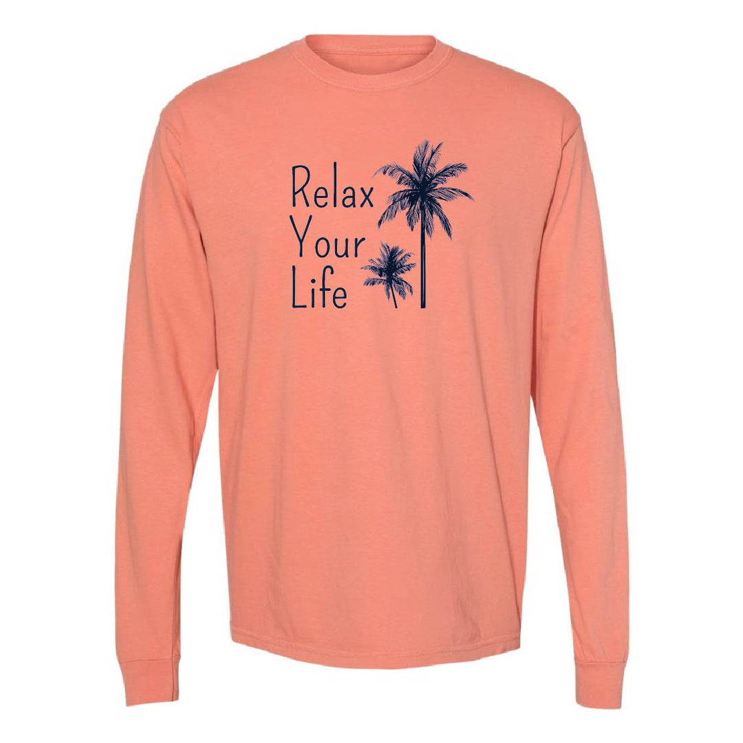 Peach long-sleeve shirt with 'Relax Your Life' text and palm tree graphics on a white background