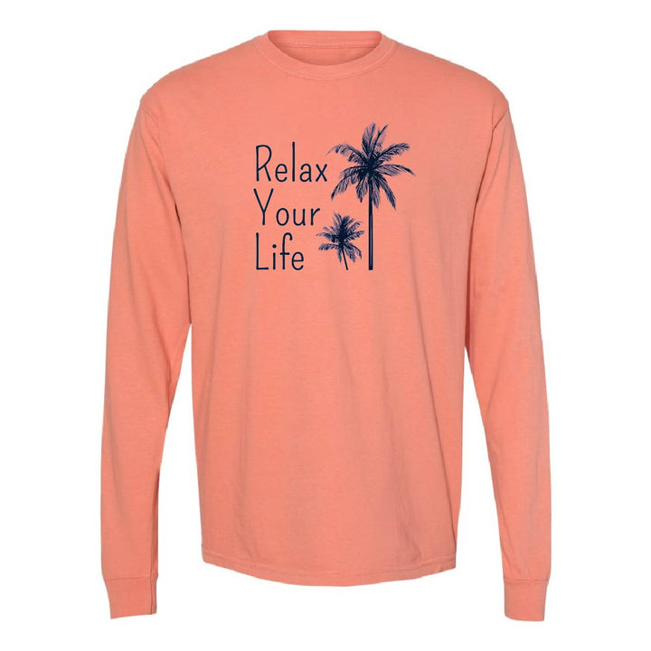 Peach long-sleeve shirt with 'Relax Your Life' text and palm tree graphics on a white background