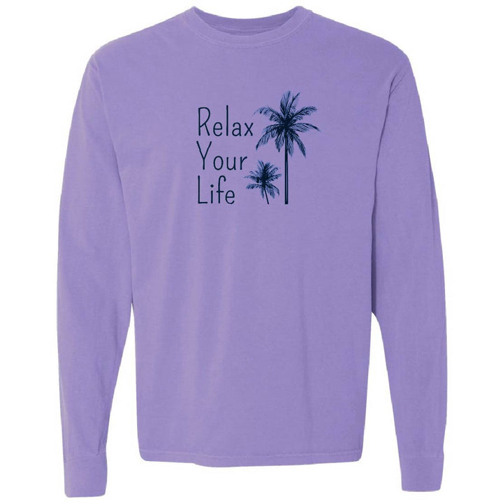 Purple long-sleeve shirt with 'Relax Your Life' text and palm tree graphics on a white background