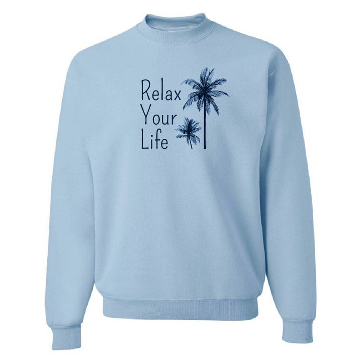 Light blue sweatshirt with 'Relax Your Life' text and palm tree graphics on a white background