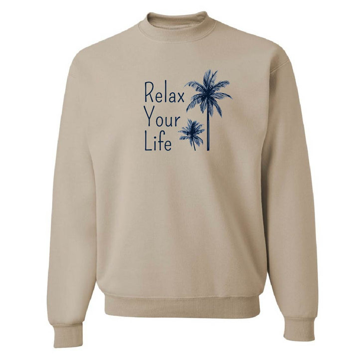 Beige sweatshirt with 'Relax Your Life' text and palm tree graphics on a white background