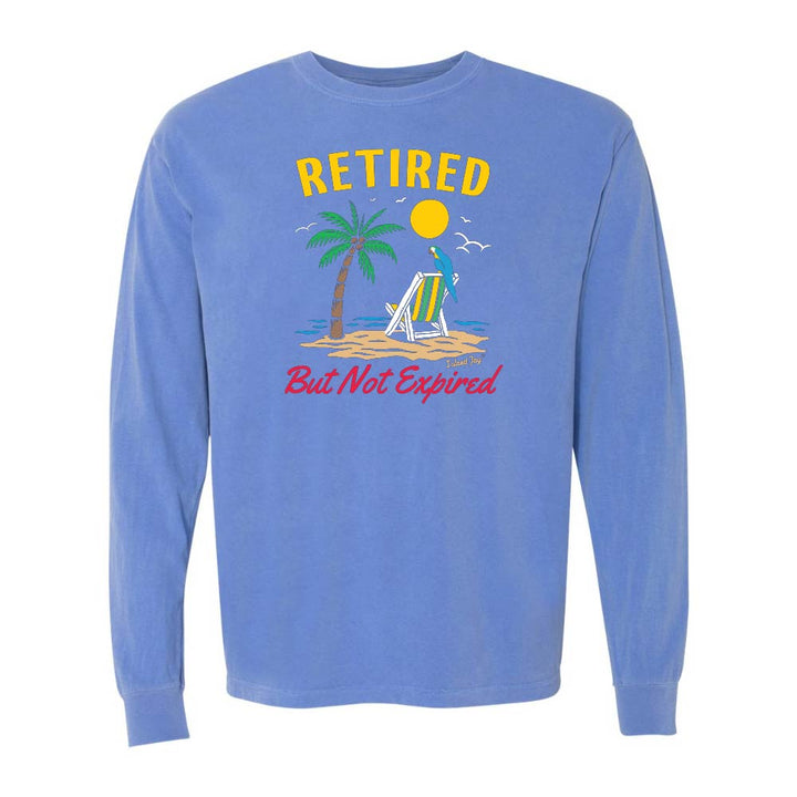 Blue long-sleeve shirt with a beach graphic and 'Retired But Not Expired' text.